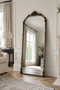 Serafina arched floor mirror in an interior setting